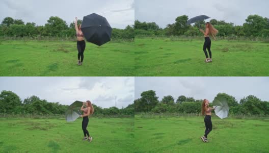 一个女人在森林里打着伞跳舞高清在线视频素材下载