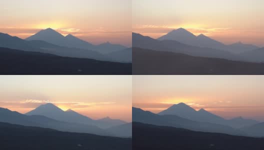 4 k的视频。俄罗斯堪察加半岛火山上空的日出和云景。高清在线视频素材下载