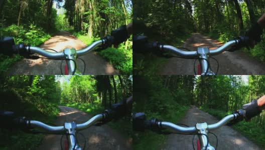 POV山地自行车穿越春天的森林高清在线视频素材下载