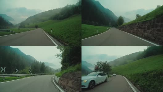 在一个雾蒙蒙的山口上装有摄像头的汽车高清在线视频素材下载