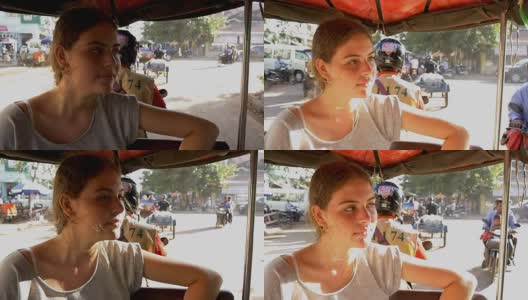 年轻的女孩独自骑着嘟嘟车在亚洲旅行高清在线视频素材下载
