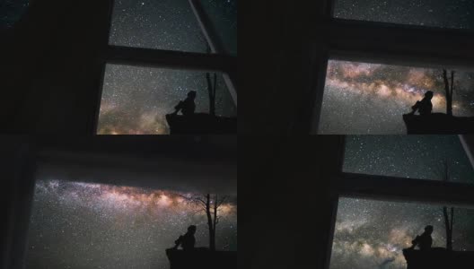 透过窗户看到孤独的女孩和银河高清在线视频素材下载