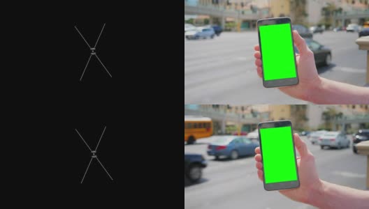 在拉斯维加斯大道附近拿着绿屏智能手机高清在线视频素材下载