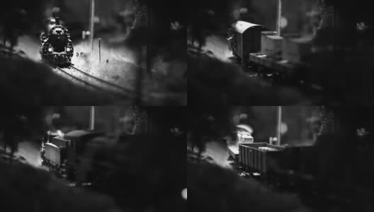 一辆玩具火车头和几辆货车四处走动的黑白画面高清在线视频素材下载
