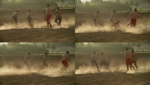 乡村的孩子们在阳光明媚的日子里踢足球。高清在线视频素材下载