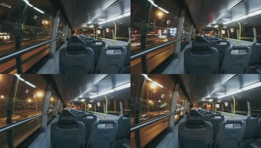 T/L WS PAN Inside View of Bus Moving Down Street at Night /北京，中国高清在线视频素材下载