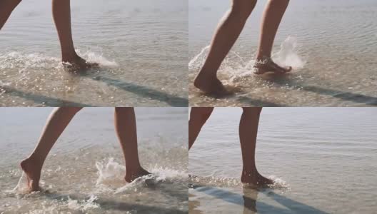 一个年轻女人的腿在海边散步。女子沿着海岸奔跑溅起海水，慢镜头。女人赤脚跑进浅浅的透明海水里。高清在线视频素材下载