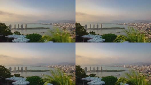 日落照明三亚公园俯视图城市景观全景4k时间推移海南岛中国高清在线视频素材下载