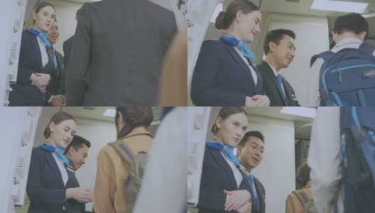 亚洲的空乘人员穿着衣服向乘客问好高清在线视频素材下载