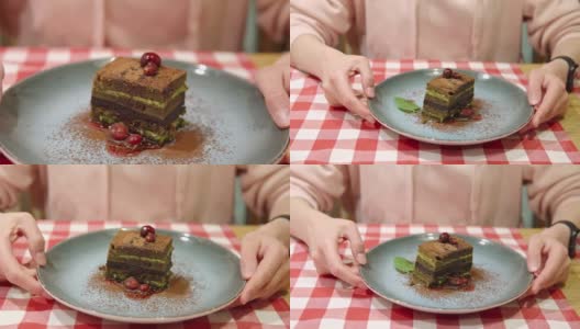 抹茶绿茶层糕在女性手中盘上高清在线视频素材下载