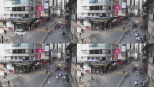航拍模糊离焦的交通车辆和行人过街高清在线视频素材下载