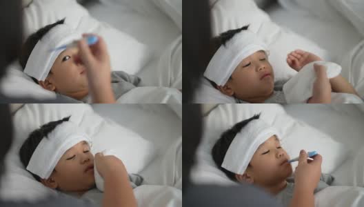 亚洲孩子感到恶心的温度计和母亲。照顾和生病的概念高清在线视频素材下载