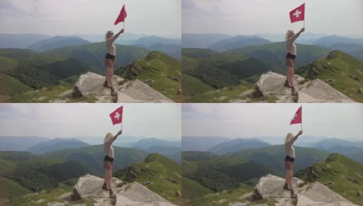 拿着瑞士国旗的女人在蒙特杰内罗索高清在线视频素材下载