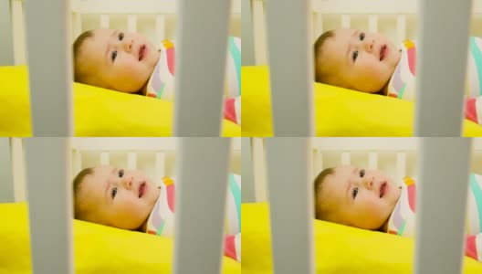 婴儿在床上哭。有选择性的重点高清在线视频素材下载