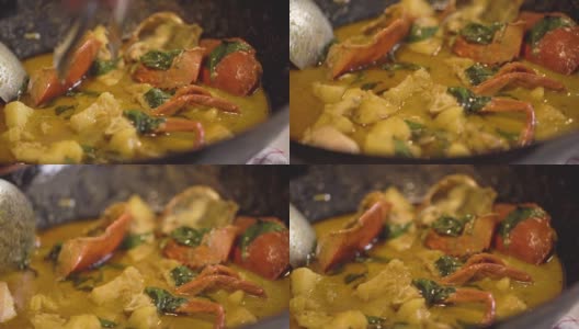 黑蟹菠萝咖喱的特写，在锅里烹饪泰国菜高清在线视频素材下载