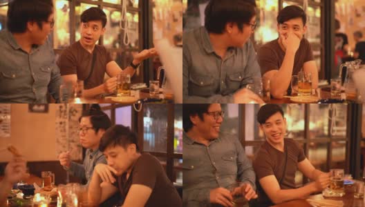 三杯两亚洲男人在居酒屋日本酒吧餐厅喝酒聊天高清在线视频素材下载