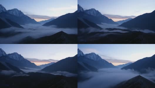在时间的推移中，美丽的山谷在定伯切附近的全景，昆布，尼泊尔在喜马拉雅山与雄伟的雪山后日落和云移动回山谷。高清在线视频素材下载