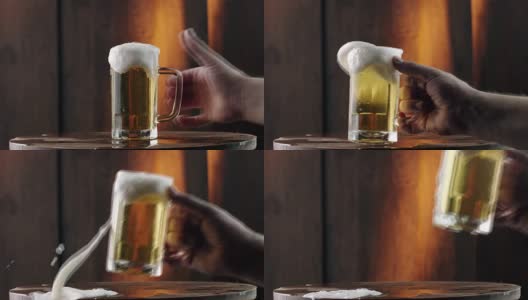 手拿满杯啤酒高清在线视频素材下载