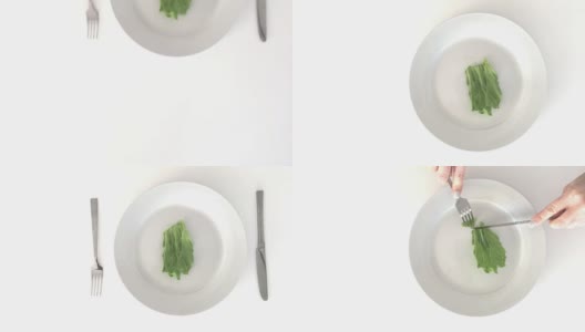 女人用手吃着一片生菜高清在线视频素材下载