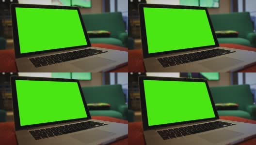 一般的笔记本电脑在酒店大堂等候区，有绿色屏幕的角钉高清在线视频素材下载