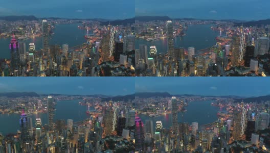 在香港太平山顶的摩天大楼和海湾上空飞行的无人机高清在线视频素材下载