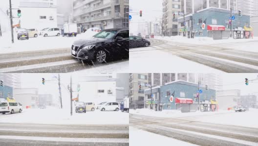 日本札幌市早上的道路和交通上都下着雪高清在线视频素材下载