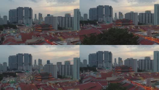 日落飞行在新加坡城著名的中国城屋顶交通街道空中自上而下全景4k高清在线视频素材下载