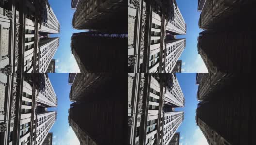 仰望在纽约纽约曼哈顿现代商业摩天大楼的滑翔镜头高清在线视频素材下载