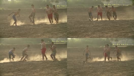 乡村的孩子们在阳光明媚的日子里踢足球。高清在线视频素材下载