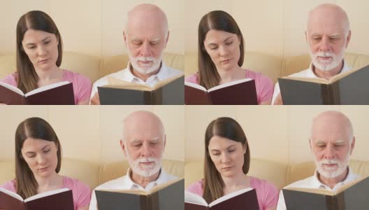 父亲和女儿阅读纸质书。传统古典读本的概念高清在线视频素材下载