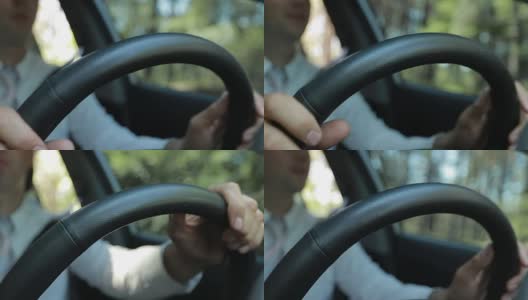 男人开车时手握方向盘高清在线视频素材下载