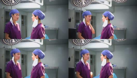 4K:亚洲两名外科医生在外科手术室进行手术。高清在线视频素材下载