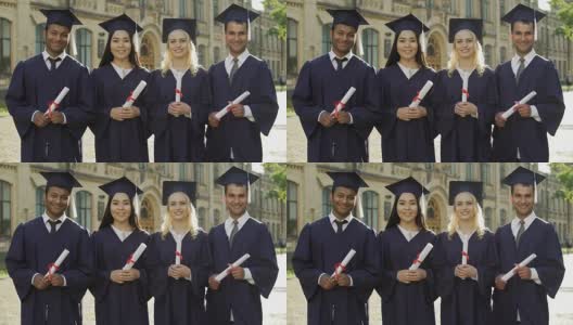 留学生在毕业装中持有毕业证书，接受素质教育高清在线视频素材下载
