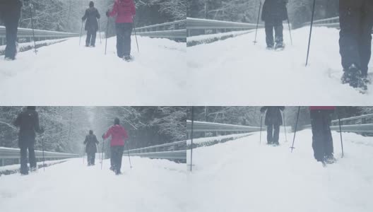 广角镜头的三个年轻的女士徒步在一个下雪天高清在线视频素材下载