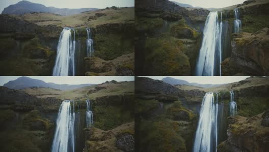冰岛美丽的Gljufrabui瀑布鸟瞰图。直升机飞近著名的景象，强大的气流高清在线视频素材下载