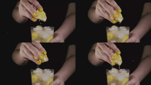 缓慢的运动。女人的手挤一片柠檬高清在线视频素材下载