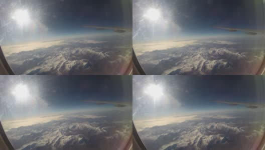 透过飞机窗户观看雪山上空的飞机机翼高清在线视频素材下载