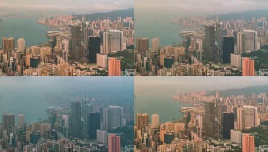 从早到晚，日落时分，香港的天际线渐渐消失。从太平山顶俯瞰香港摩天大楼高清在线视频素材下载
