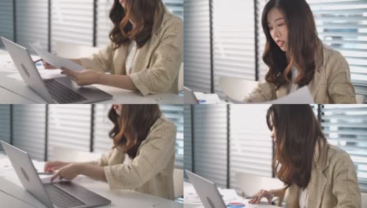 亚洲女商人在办公室用笔记本电脑工作高清在线视频素材下载
