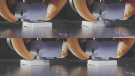 3D打印机从白色abs塑料中打印出一个抽象的立方体形状。3D打印机头在行动。一台自动三维3d打印机可以打印塑料。宏。高清在线视频素材下载