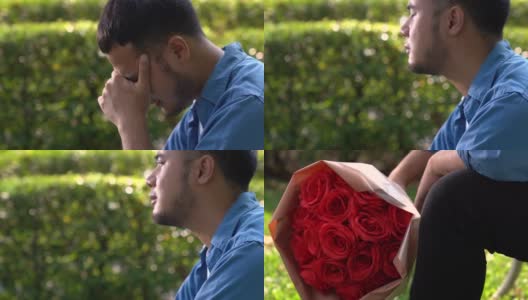 一个伤心的男人拿着一束玫瑰坐在公园的长椅上高清在线视频素材下载