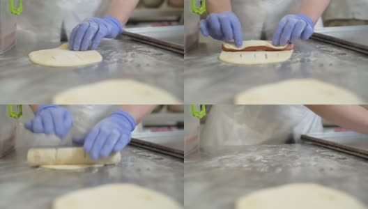 厨师把美味的香肠包在面团里。小型企业理念，DIY制造高清在线视频素材下载