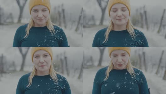 一个女人在外面的雪地里摆姿势深呼吸的肖像高清在线视频素材下载