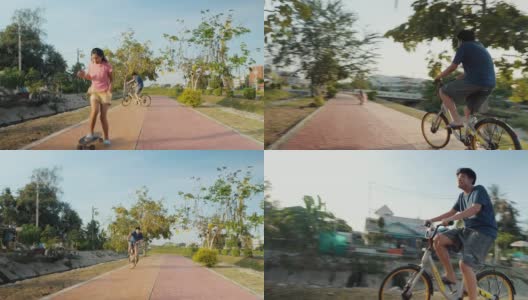 快乐的亚洲儿童，在阳光照耀下，在小路上一起骑自行车和滑板，健康的生活理念。高清在线视频素材下载