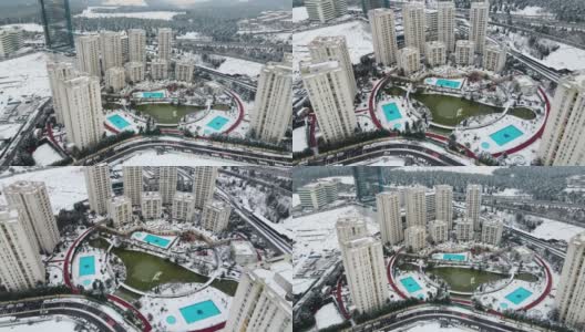 住宅小区，雪住宅小区，空中雪摩天大楼，空中雪公寓，下雪天的住宅，冬天的城市景观，冬天的公寓，城市转型高清在线视频素材下载