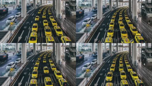 T/L TU繁忙的黄色出租车排队在机场出口高清在线视频素材下载