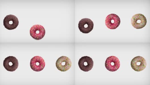 三个不同颜色的甜甜圈在白色背景上的抽象旋转动画。高清在线视频素材下载