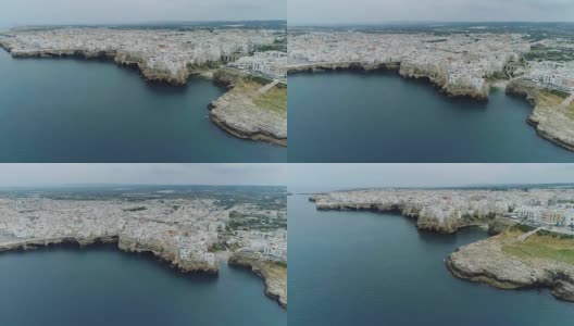城市海岸线和白色房屋波利尼亚诺一Mare Apulia在意大利无人机全高清高清在线视频素材下载