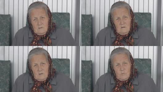 一个戴着棕色头巾的老妇人的特写高清在线视频素材下载