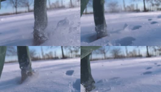 一个人的脚在雪山上行走的特写。慢动作拍摄高清在线视频素材下载
